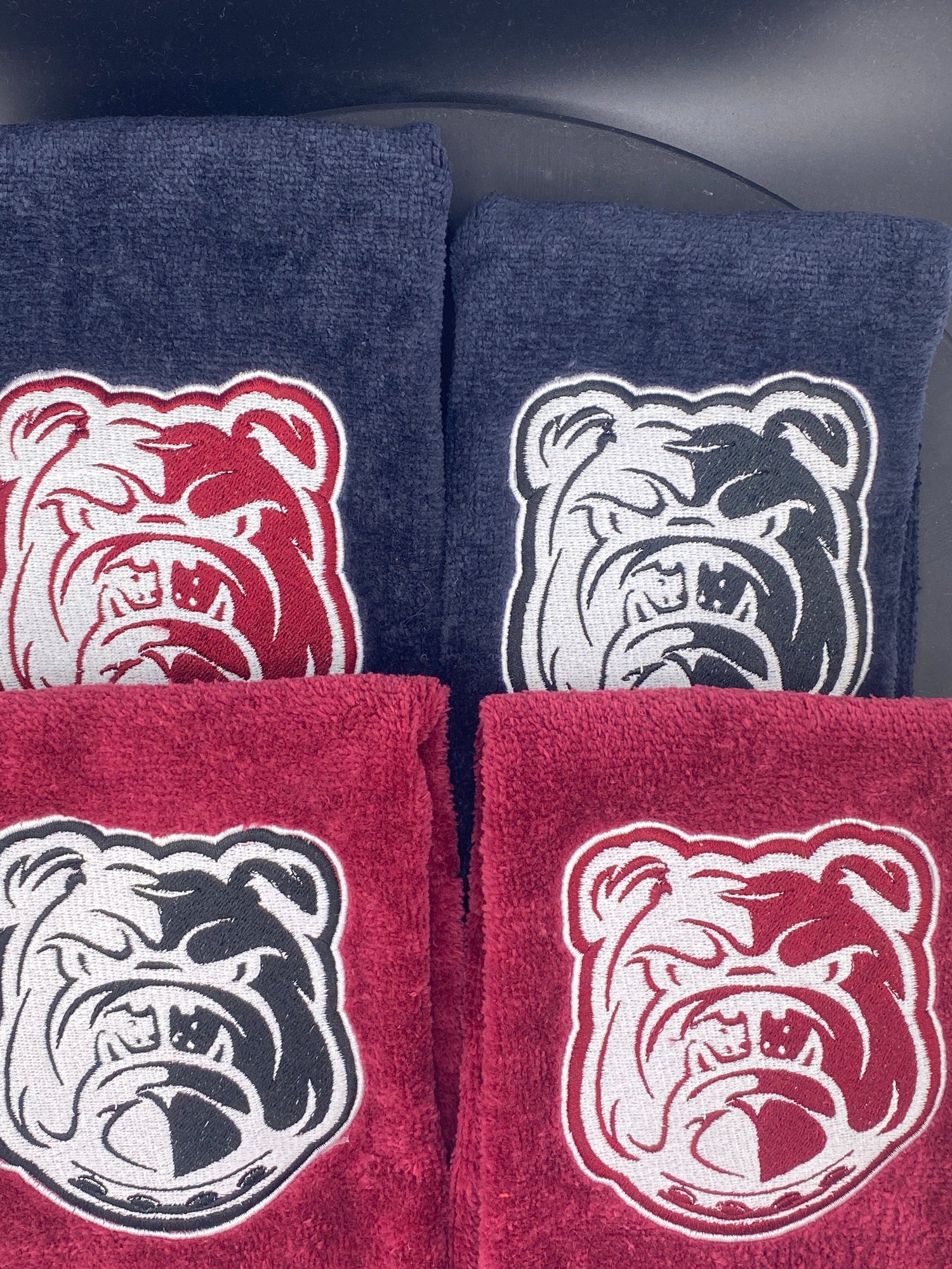 4 velour leisure luxe towels in black and marroon representing Alabama A&M Bulldogs - West & Remount Custom Apparel
