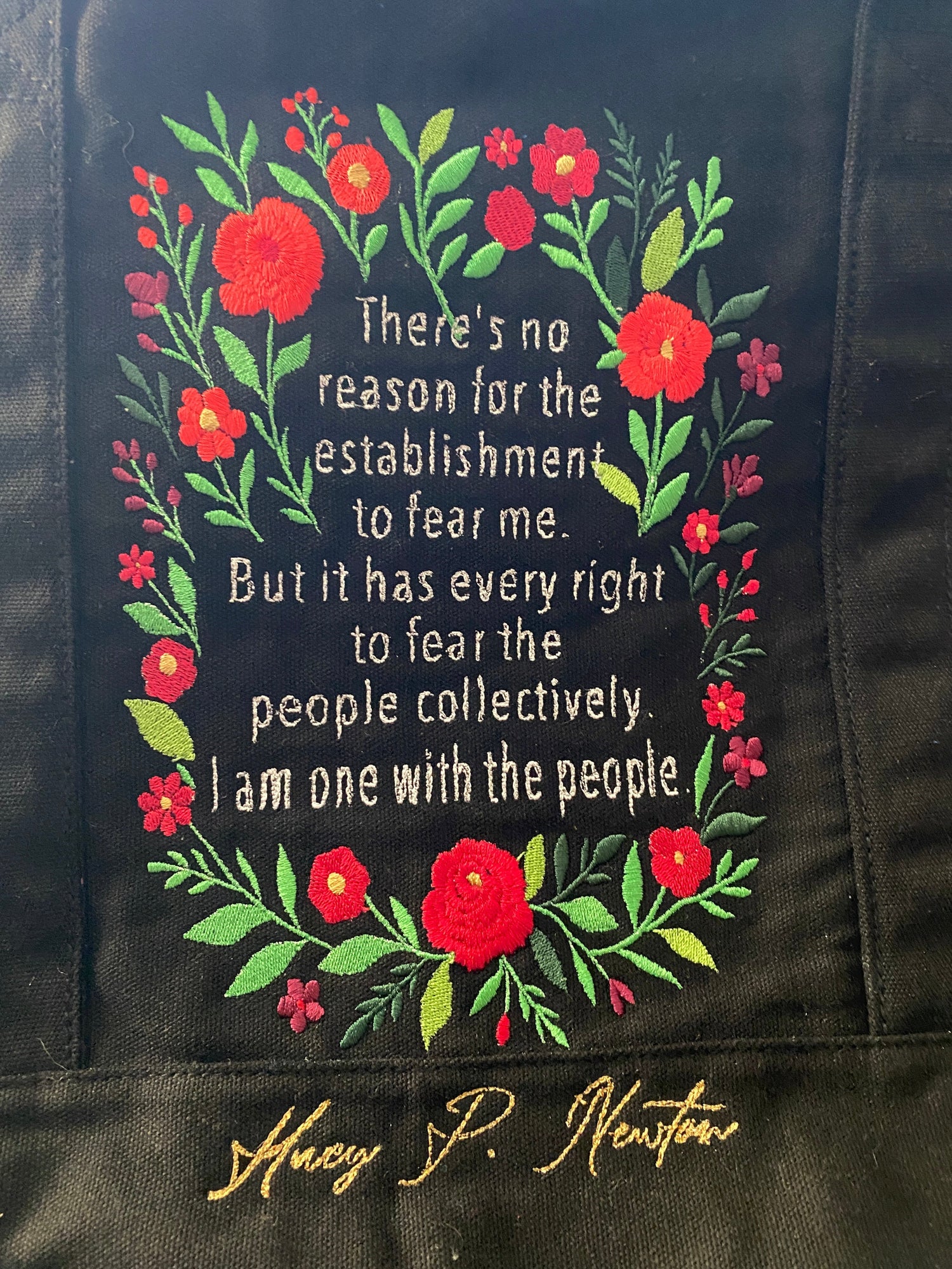 Embroidered canvas tote bag featuring the words of Huey P. Newton surrounded by flowers - West & Remount Custom Apparel