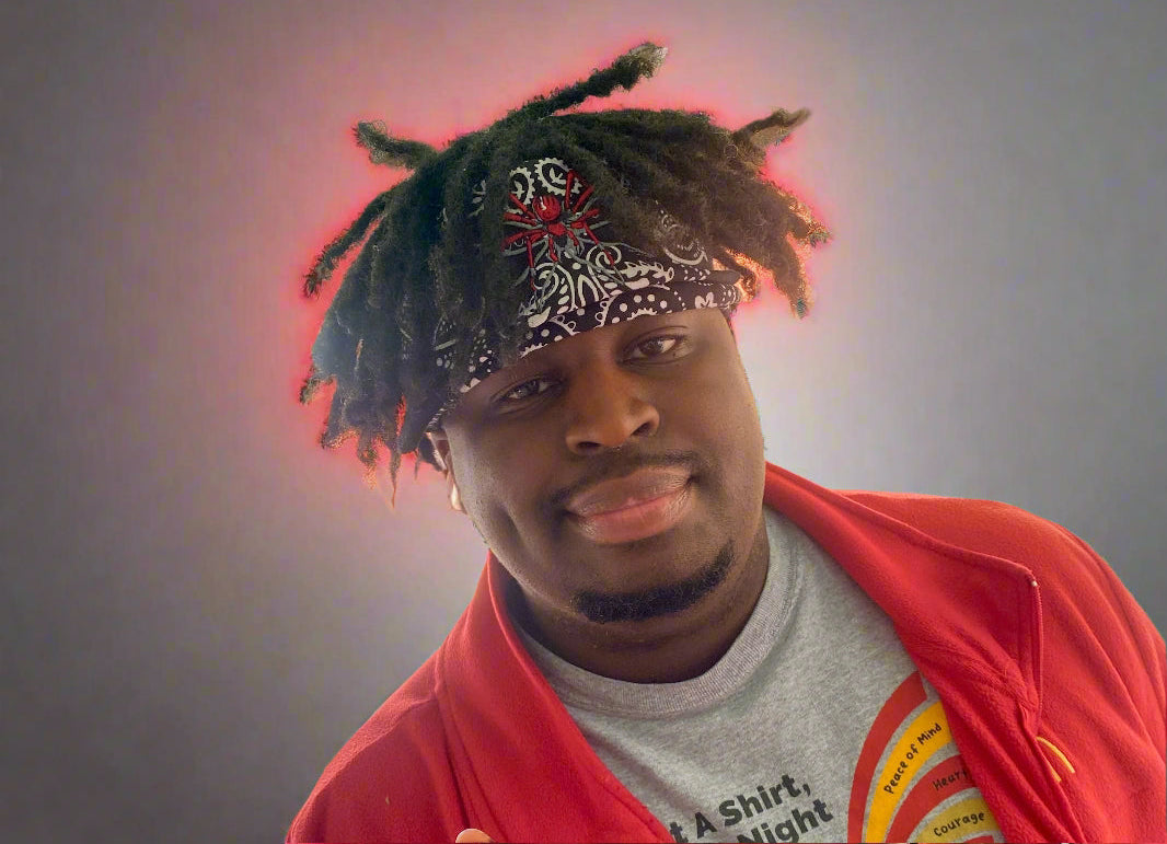 A cool gamer sports his signature look - a bandana with an embroidered red spider on the front. 
