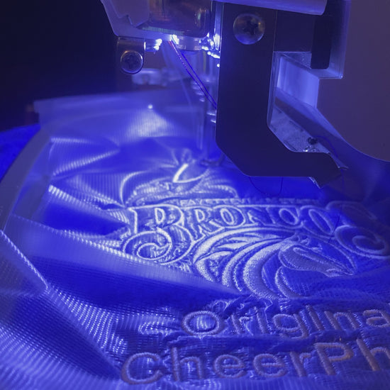 In-progress video of personalizing a royal blue Leisure Luxe Towel. 